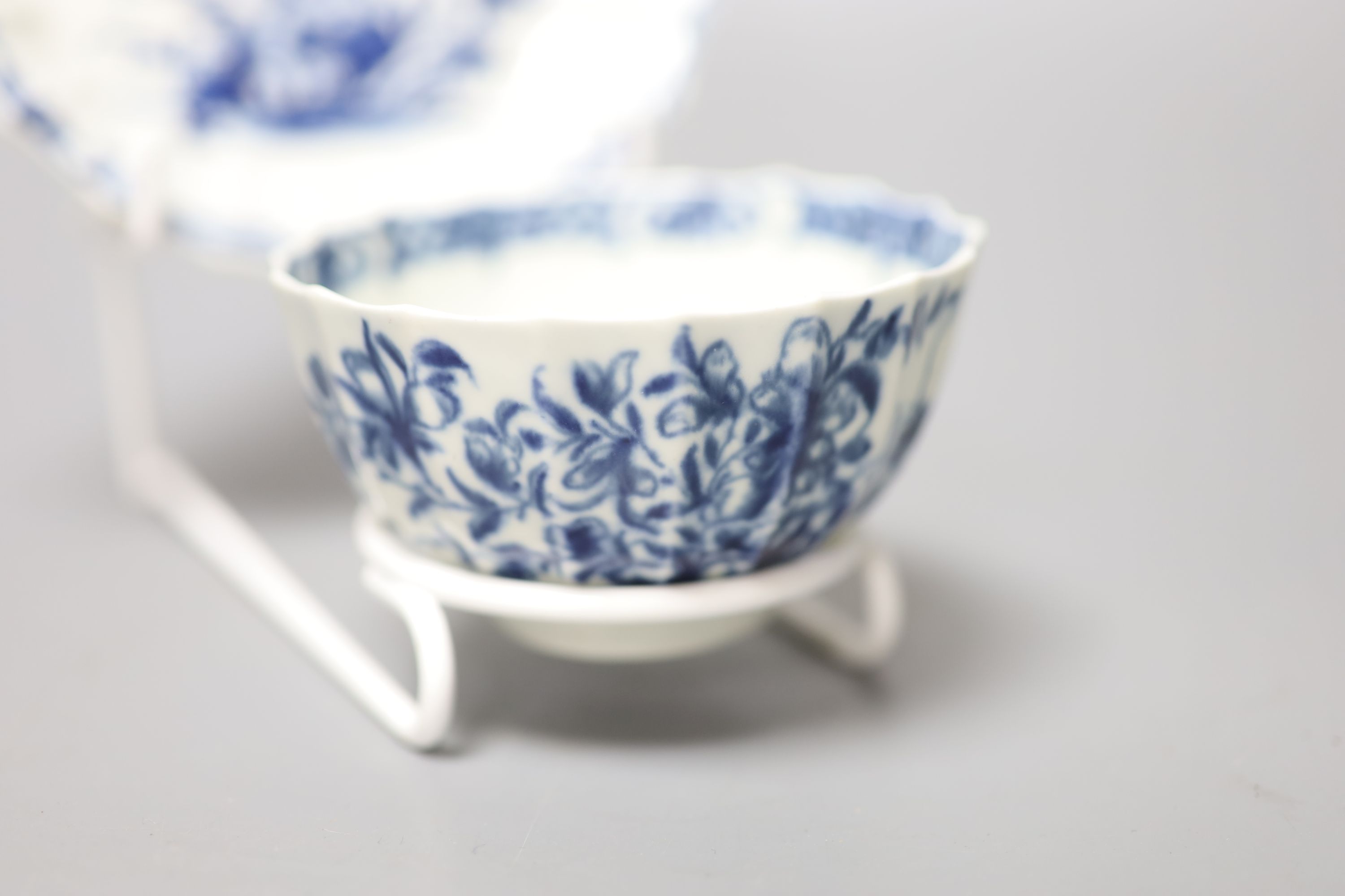 An 18th century Worcester tea bowl and saucer painted with the Hollow Rock Lily pattern, crescent marks